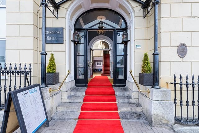 Elegant red carpet entrance at Commodore Hotel's Club Lounge, perfect for receptions and conferences.
