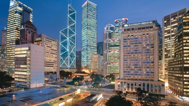 Banquet hall with Hong Kong skyline, perfect for corporate events and conferences.