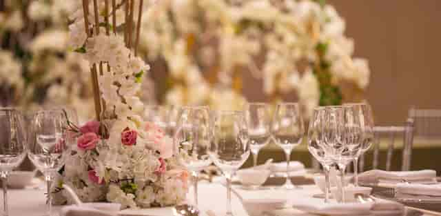 Elegant banquet table with floral centerpieces at China World Hotel, ideal for weddings.