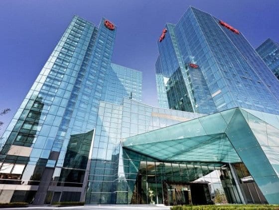 Modern Sheraton Hotel conference hall with glass exteriors for corporate events.