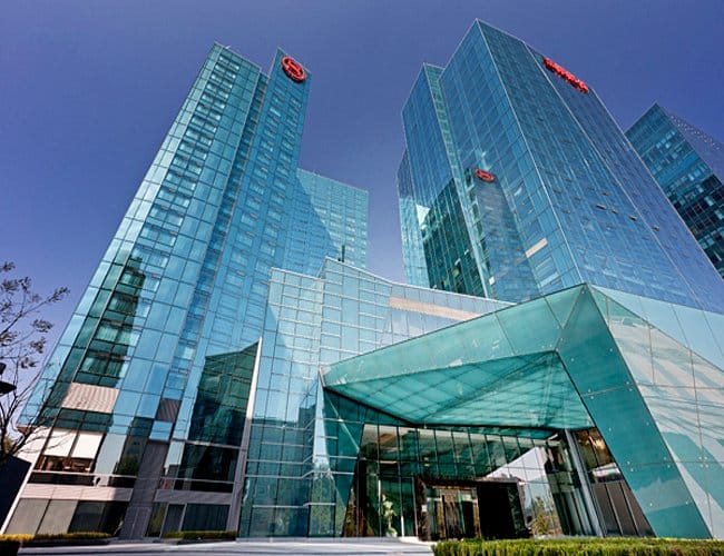 Modern glass-front Sheraton meeting room, ideal for corporate events and conferences.