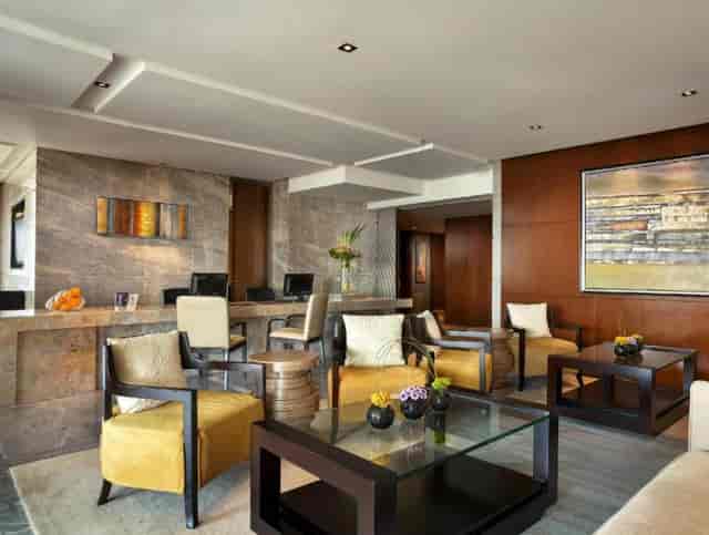 Modern Sheraton Hotel meeting room with stylish furnishings for networking events.