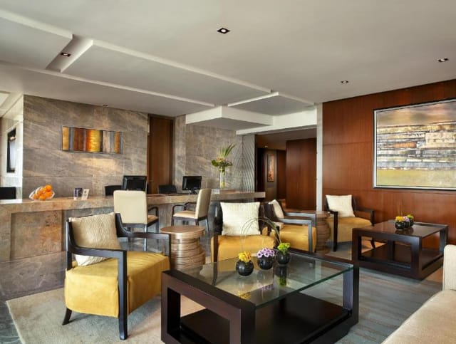 Modern Sheraton Hotel meeting room with stylish furnishings for networking events.