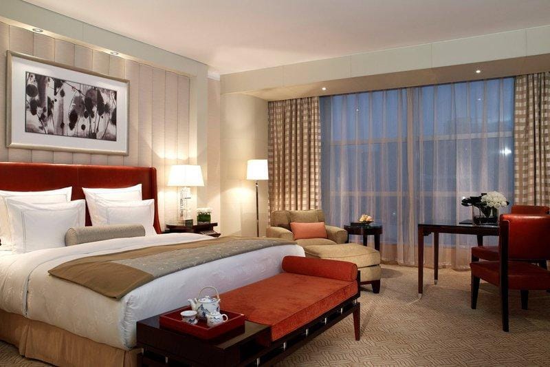 Elegant hotel room at Ritz-Carlton Beijing, ideal for events and meetings.