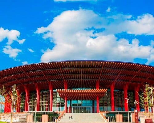Modern Beijing Convention Center with striking red architecture, ideal for conferences and exhibitions.
