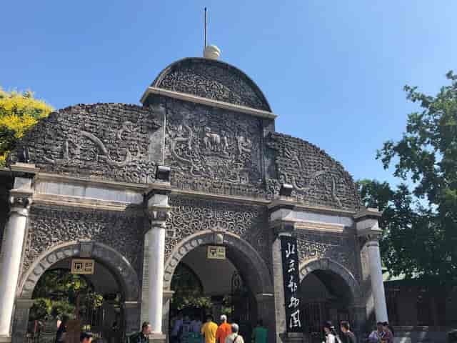Ornate stone gateway at Beijing Zoo, perfect for themed events and cultural gatherings.