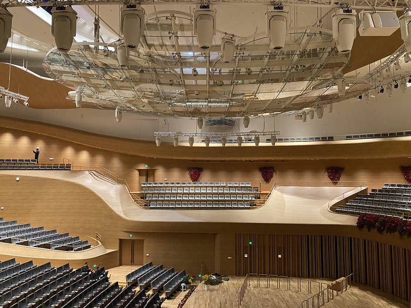 Modern auditorium with tiered seating for conferences and performances at National Centre.