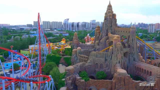 Beijing Happy Valley amusement park with vibrant roller coaster and event venue.