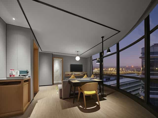 Modern meeting room with large windows at Hilton Garden Inn Daxing, perfect for corporate events.