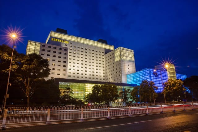 Modern hotel exterior at night, ideal for events and meetings in Beijing.