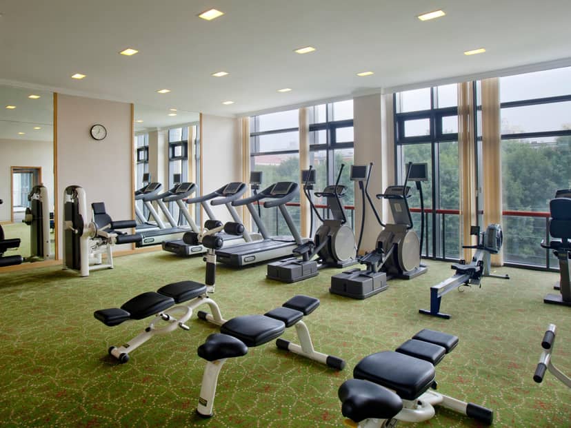 Modern fitness center at Holiday Inn Beijing, ideal for conference wellness activities.