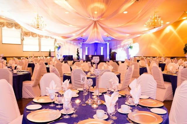 Elegant Mercanti Napoli Ballroom with blue and gold decor for weddings and corporate events.