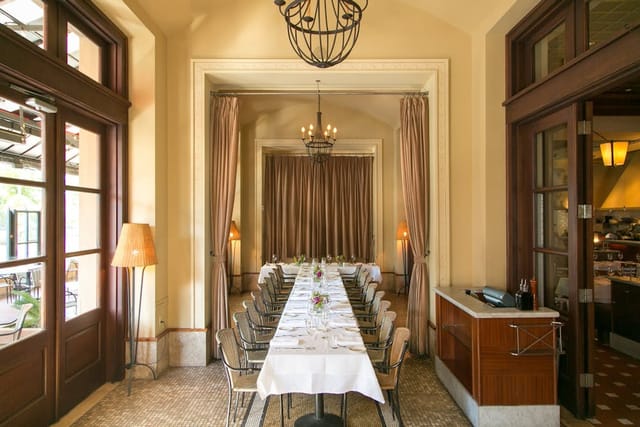 Elegant semi-private dining area with warm lighting, perfect for intimate gatherings or meetings.