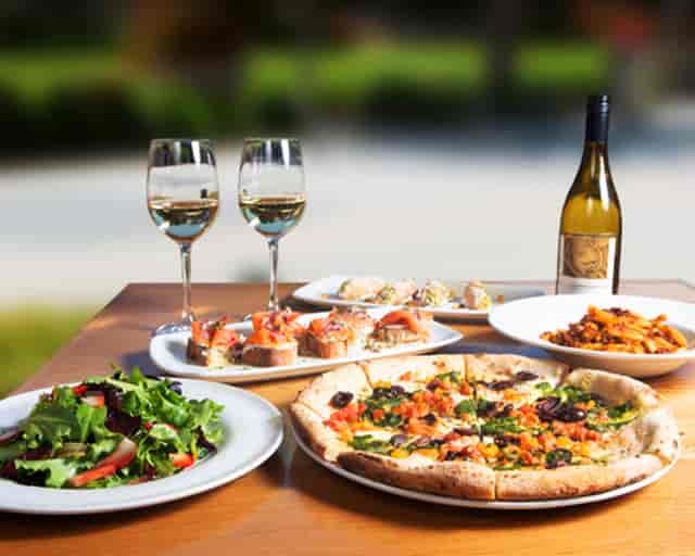 Elegant dining setup at Il Fornaio for networking and corporate events with gourmet cuisine.