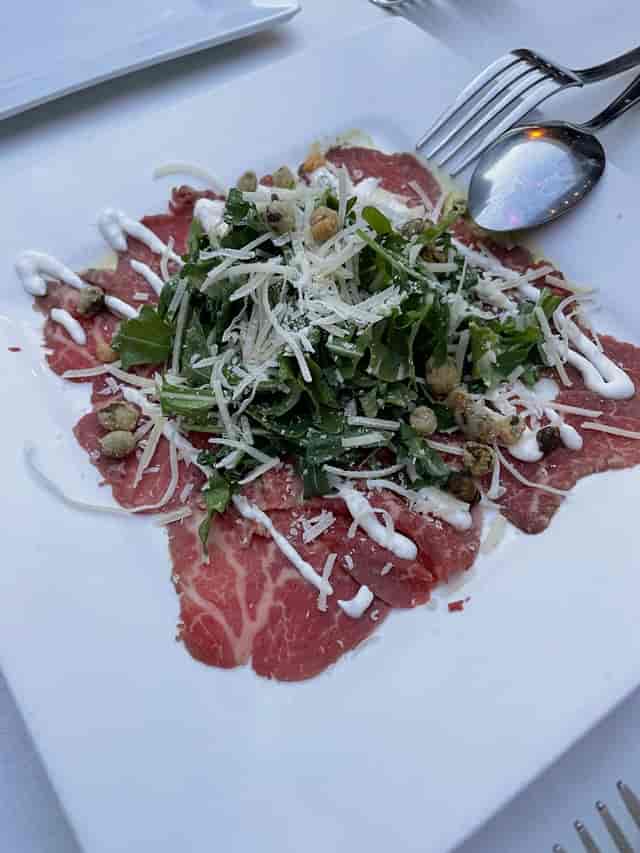 Upscale carpaccio dish at Mistral Restaurant, perfect for corporate events and gourmet catering.