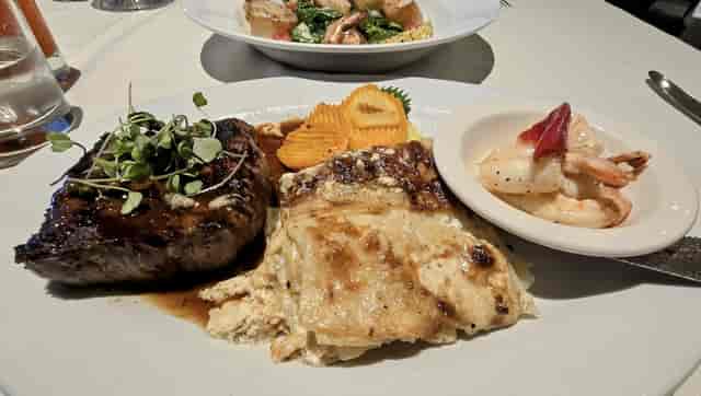 Succulent steak with creamy potatoes at Mistral Restaurant & Bar for upscale dining.