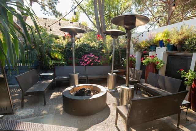 Private outdoor patio with fire pit at Mistral Restaurant for networking events and gatherings.