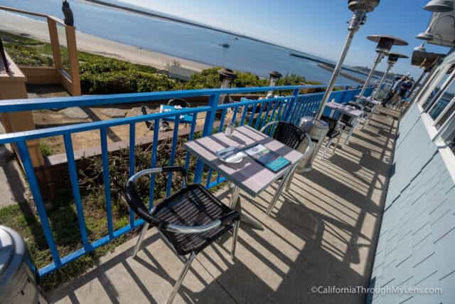 Outdoor dining at Sam's Chowder House with waterfront view, ideal for casual events.