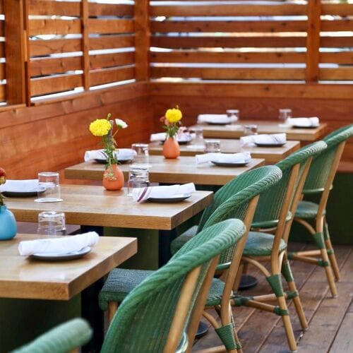 Elegant outdoor dining setup at BarZola restaurant, perfect for gatherings and meetings.