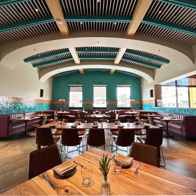 Modern restaurant space with vibrant decor, ideal for events and private dining.