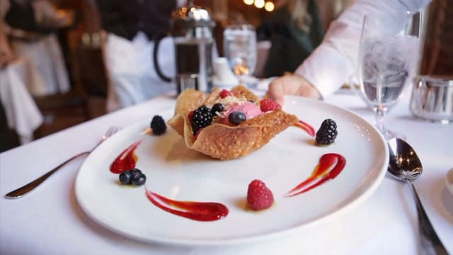 Elegantly plated dessert with berries at Culinary Institute of America event. 