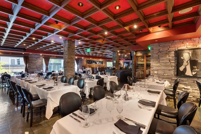 Upstairs Buyout at Mastro's: elegant dining setup for corporate events and private gatherings.