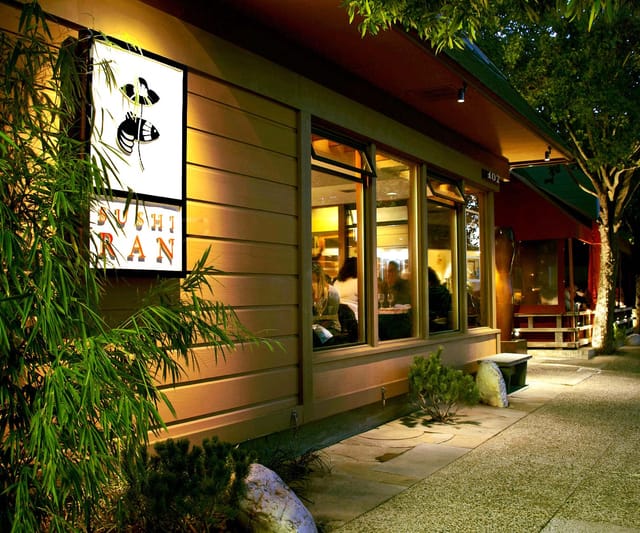 Cozy Sushi Ran restaurant exterior with large windows, ideal for gatherings and events.