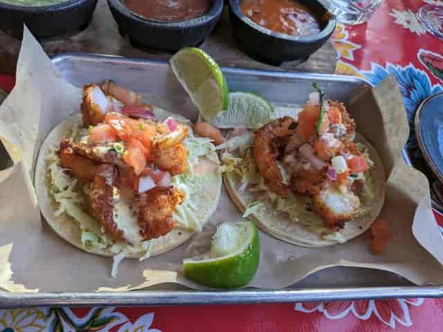 Tequila Bar fish tacos with crispy fried fish, perfect for events and local dining.