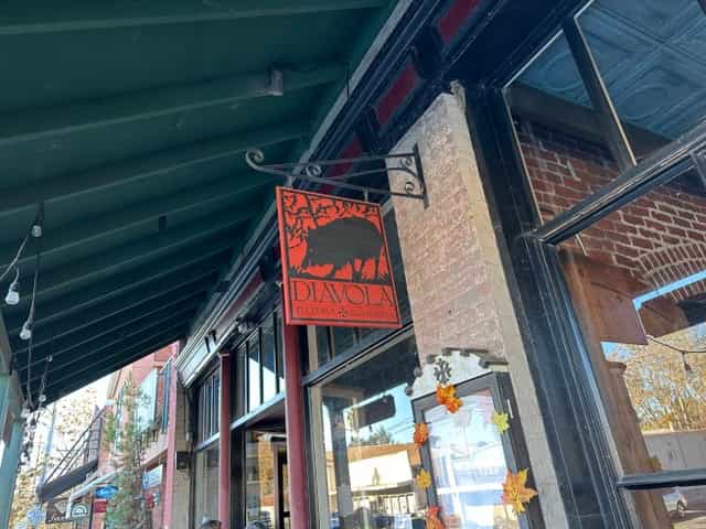 Charming Diavola Pizzeria sign, perfect for outdoor events and gatherings.