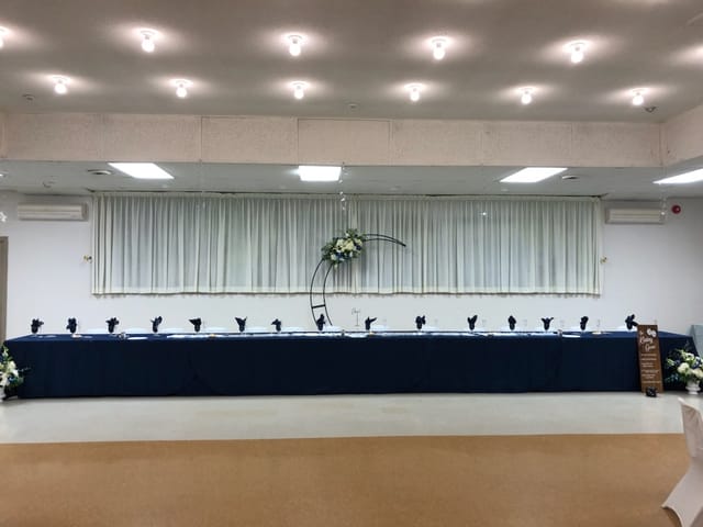 Elegant head table in Belleville Fish and Game Club for a formal event.