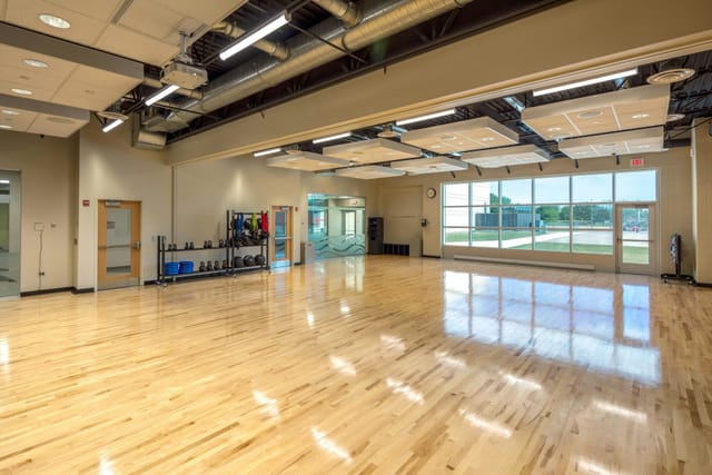 Spacious conference center with polished floors, ideal for meetings and workshops.