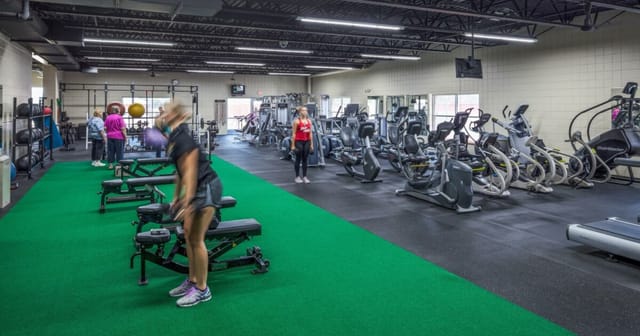 Well-equipped gym in Redwood Area Community Center for corporate wellness retreats.