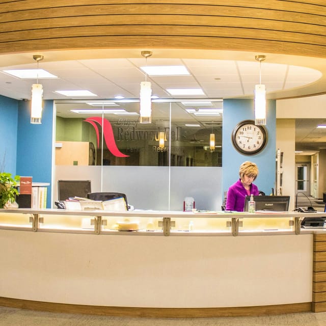 Modern front desk at Redwood Area Community Center for events and conferences.