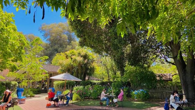 Café Wisteria outdoor venue with lush greenery for corporate retreats and meet-and-greets.