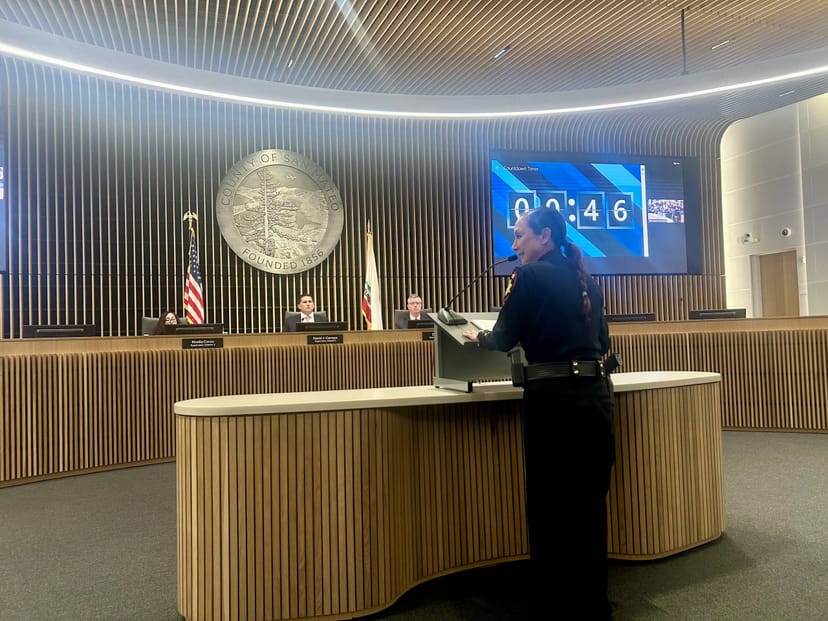 Executive Committee meeting at San Mateo County Event Center with speaker addressing audience