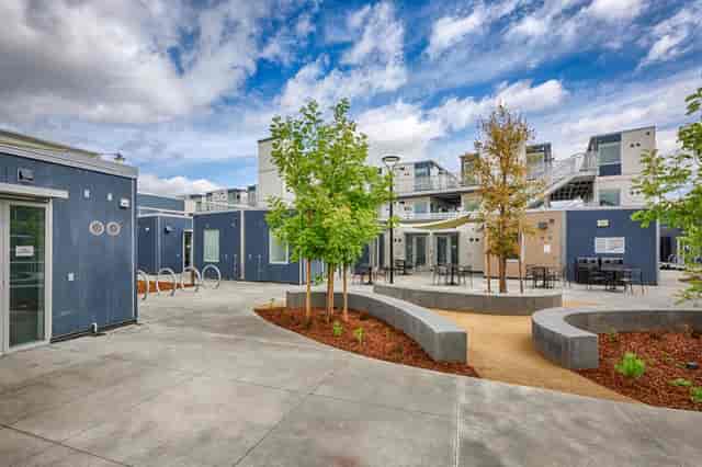 Modern outdoor event space in San Mateo County with flexible seating and greenery.