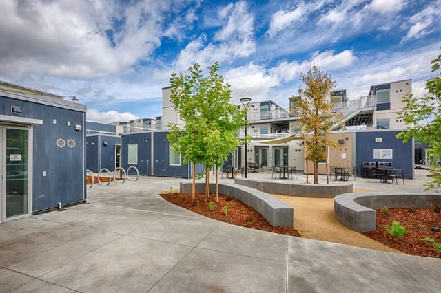 Modern outdoor event space in San Mateo County with flexible seating and greenery.