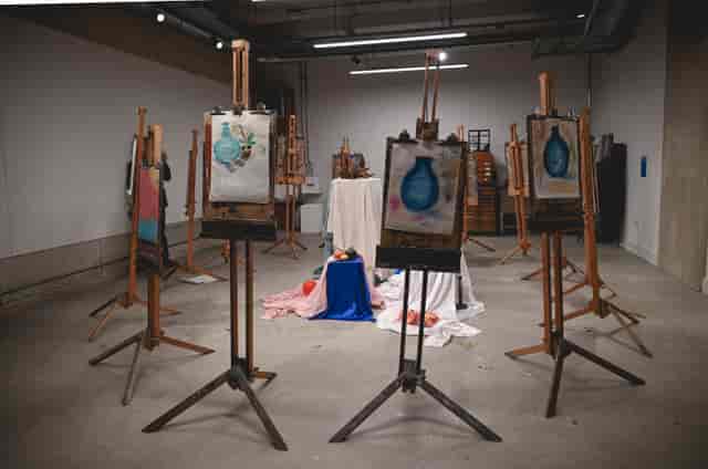 Art Academy workshop setup with easels for creativity and collaboration events.