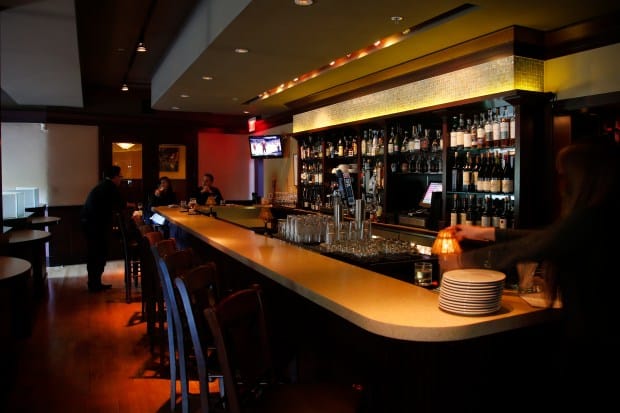 Modern bar at John Bentley's, perfect for private events and social gatherings.