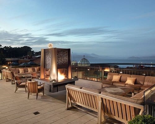 Stylish outdoor venue at Nursery Terrace with fire pit, ideal for networking events or receptions.