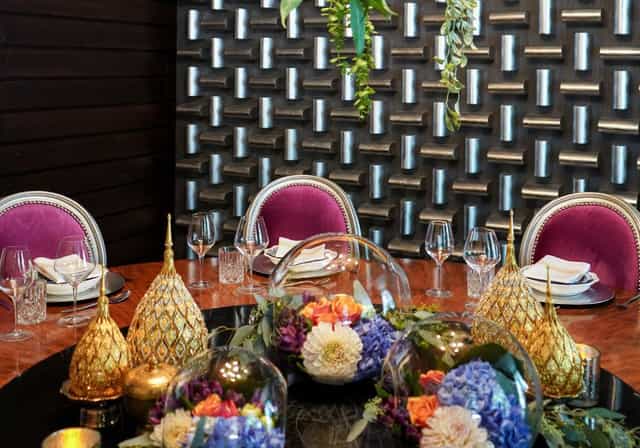 Private dining in Osha Thai Embarcadero with elegant purple chairs for upscale events.