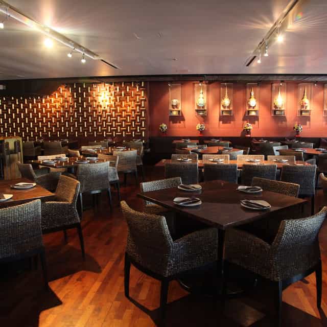 Osha Lounge: elegant dining space with warm lighting for events and gatherings.