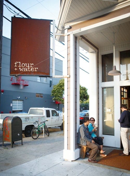 Casual outdoor networking space at Flour + Water with comfortable seating.