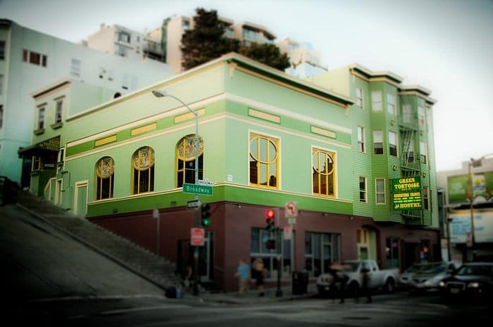 Green Tortoise Hostel common area, vibrant venue, ideal for events and gatherings.
