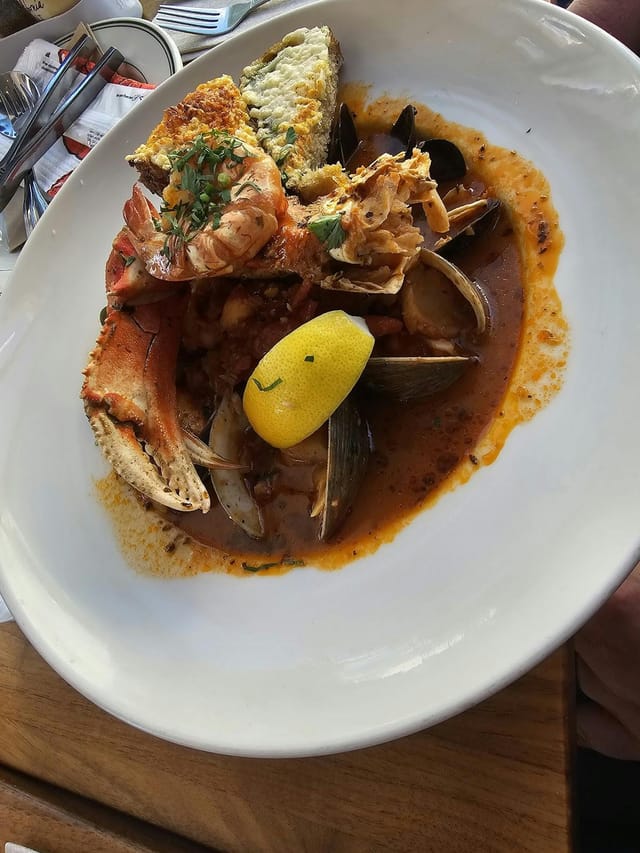 Seafood dish with crabs and clams at Woodhouse Fish Co. for event dining experience.