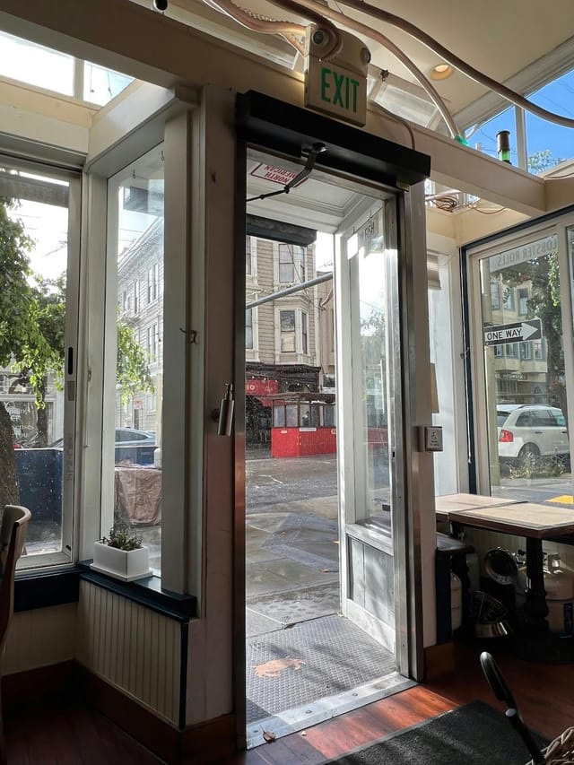 Contemporary Woodhouse Fish Co. cafe with large glass doors for networking events.