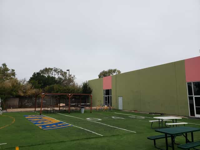 Outdoor venue in Menlo Park with grassy area for team-building events and receptions.