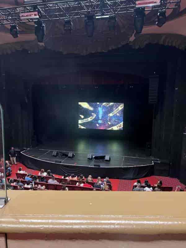 Mezzanine stage setup with vibrant visuals for engaging events and meetings.