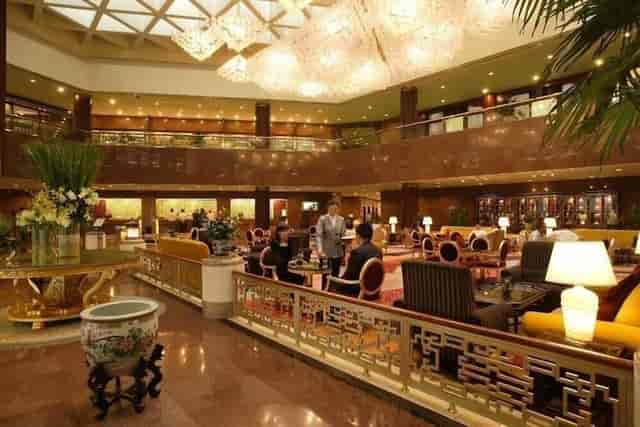 Luxurious hotel lobby in Capital Hotel Beijing, ideal for upscale events and gatherings.
