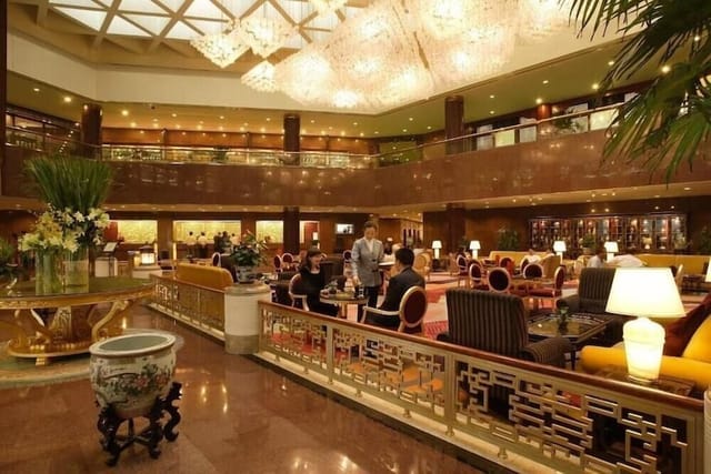 Luxurious hotel lobby in Capital Hotel Beijing, ideal for upscale events and gatherings.